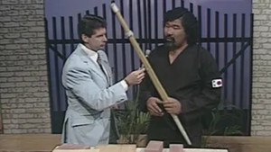 Andre the Giant sings with an oil drum band